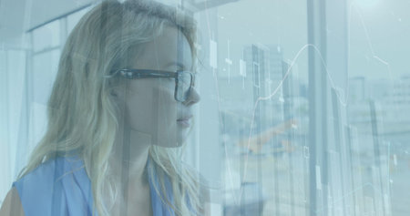 Image of data processing over caucasian businesswoman in office. Global business and digital...