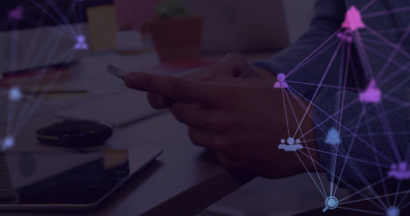 Image of web of connections with icons floating over hands of a man using a smartphone. global...