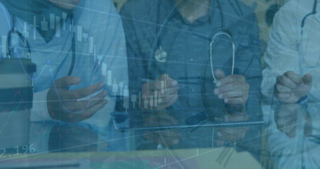 Image of graphs and data over midsection of diverse female and male doctors shaking hands. medicine,...