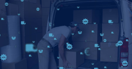 Image of digital icons floating over a caucasian delivery man packing boxes into a car. global networking concept digital composite.の写真素材