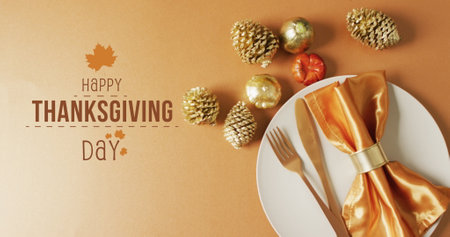 Image of happy thanksgiving day text over decorations and place setting. Thanksgiving, american tradition and celebration concept digitally generated image.の写真素材