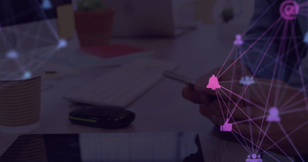 Image of web of connections with icons floating over hands of a man using a smartphone. global networking concept digital composite.の写真素材