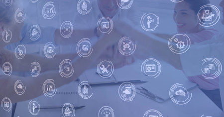 Image of network of digital icons over diverse business people stacking hands. global business, finance, networking and digital interface concept digitally generated image.の写真素材