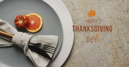 Image of happy thanksgiving day text over place setting. Thanksgiving, american tradition and celebration concept digitally generated image.の写真素材