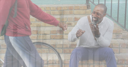 Image of financial data and graphs over african american senior man using smartphone. finance,...