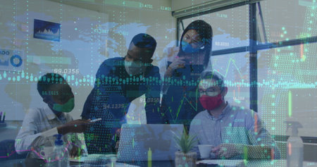 Data processing against diverse office colleagues wearing face masks discussing at office. Global...