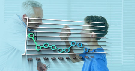 Statistical data processing against caucasian senior male doctor examining caucasian boy at...