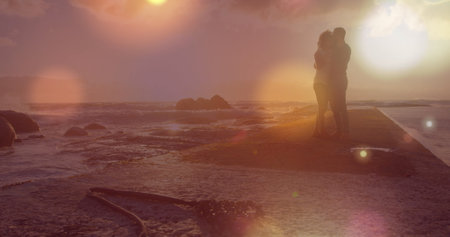 Image of light spots over african american couple at beach. Holidays and digital interface concept digitally generated image.の写真素材