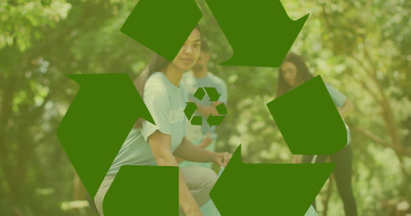 Image of ecology icons over diverse volunteers segregating waste. Recycle week, ecology and celebration concept digitally generated image.の写真素材