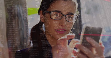 Image of digital interface over biracial women using smartphone. Global connections, data processing and digital interface concept digitally generated image.の写真素材