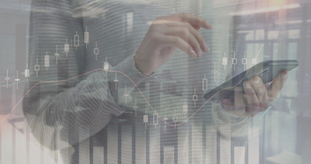 Image of financial data and graphs over hands of caucasian woman using smartphone. finance, economy,...