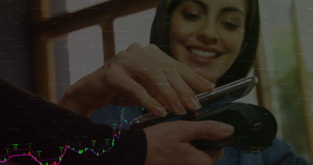 Image of financial data processing over diverse people paying with smartphone. Global finances,...