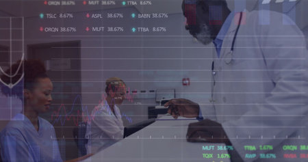 Image of graphs, trading boards over diverse nurse handing patient reports to male doctor. Digital composite, multiple exposure, report, business, stock market, medical and healthcare concept.の写真素材