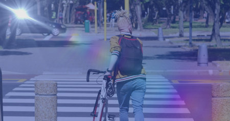 Image of light spots over albino african american man walking with bicycle. national bike to work...