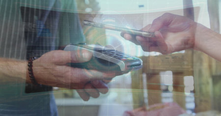 Caucasian colleague holding smartphone over payment terminal. She has light skin, blonde hair, and...
