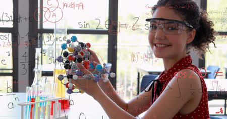 Image of mathematical formulae over smiling schoolgirl. education, childhood, creativity,...