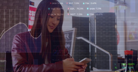 Image of graphs and trading boards, asian woman using smartphone while sitting in restaurant....