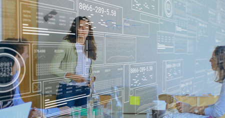 Image of screens with data processing over diverse business people in office. Global business,...