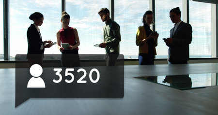 Silhouette of business people in the back of a box with numbers and human icon. They are discussing while the numbers are counting 4kの写真素材