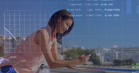 Image of multiple graphs and trading boards over biracial woman using smartphone. Digital composite,...