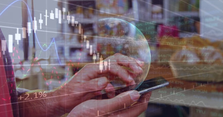 A stock market display with a globe, white stock market tickers and graphs. The price is shown going...