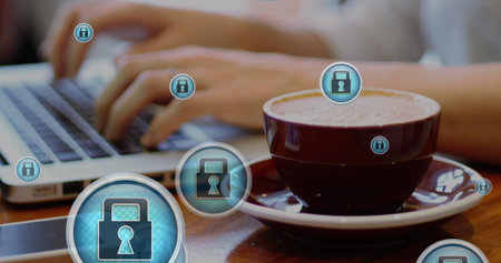 Image of padlock icons, close up of coffee cup, midsection of caucasian man working on laptop....