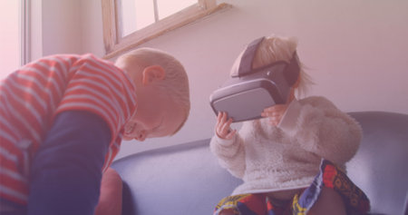 Image of smiling caucasian siblings playing with vr headset. national siblings day and celebration concept digitally generated image.の写真素材