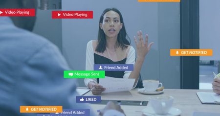 Image of notification bars over diverse woman sharing ideas with coworkers in office. Digital...