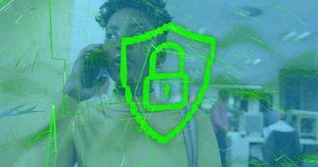 Image of digital padlock over african american woman in office having call. Data safety, business,...