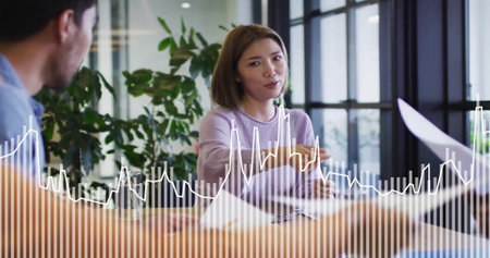 Image of data processing over diverse colleagues discussing work in office. Business, communication,...