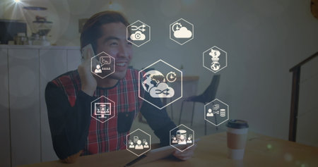 Multiple graduation hats icons against caucasian female teacher smiling at home. Global business and technology concept.の写真素材