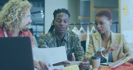 Image of school backpack data processing over business people working in office. Global computing, finance, business and data processing concept digitally generated image.の写真素材