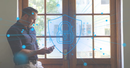 Image of purple padlock and spots over caucasian man using smartphone. Global business, technology...