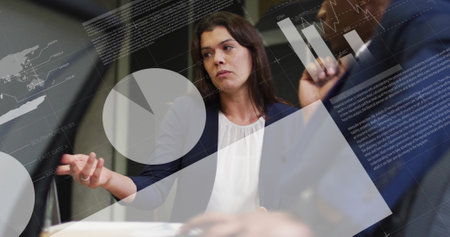 Image of infographic interface over diverse businesswoman discussing report with man in office. Digital composite, business, data, coding, progress, teamwork, laptop, technology and planning.の写真素材
