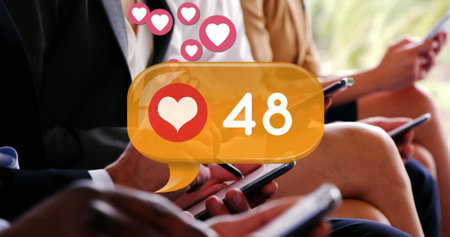 Digital image of a heart icon and increasing numbers inside a yellow chat box. There are people in...
