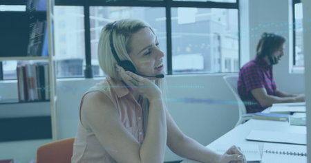 Image of data processing over business people working in office. Global computing, finance, business and data processing concept digitally generated image.の写真素材