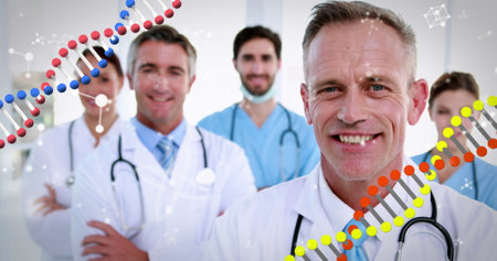 Image of DNA strands spinning over portrait of group of doctors with stethoscopes wearing lab coats smiling to camera. Global medicine concept digitally generated image.の写真素材