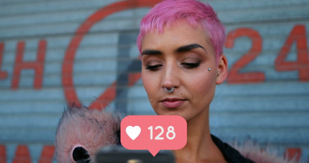 Close up of a punk woman checking her phone with a heart icon increasing numbers below 4kの写真素材