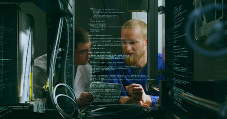 Image of data and digital interface moving over two male colleagues looking at a digital tablet in...