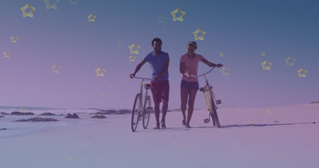 Golden star icons against african american couple with bicycle walking together at the beach. pedal...