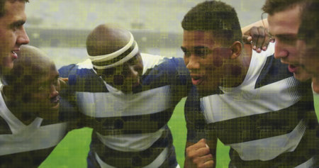Image of colourful squares over male rugby players at stadium. sport and competition concept...