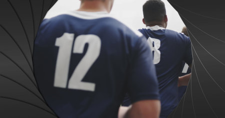 Image of black shapes over male rugby players at stadium. sport and competition concept digitally...