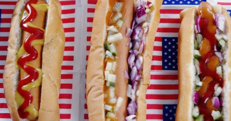 Image of white and red stripes and human silhouette over hot dogs. presidents day, independence day and american patriotism concept digitally generated image.の写真素材