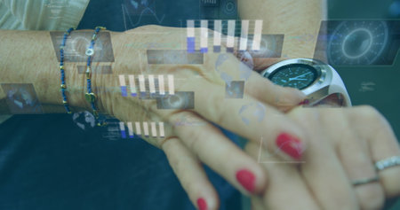 Image of data processing on digital screen over hands of caucasian woman using smartwatch. Active lifestyle, communication and technology concept digitally generated image.の写真素材