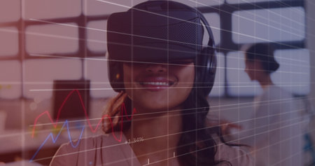 Image of financial data processing over business people using vr headsets. global business, connections, digital interface and technology concept digitally generated image.の写真素材