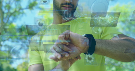 Image of data processing over biracial sportsman checking smartwatch. Global sport and digital...