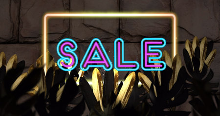 Image of sale text and neon frame over leaves on brick background. Retro future and digital...