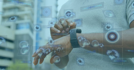 Image of scope scanning over african american man using smartwatch. Global business and digital...