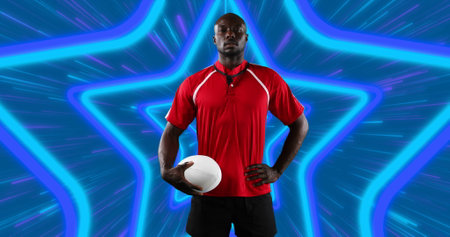 African american male rugby player holding rugby ball against neon star shapes in seamless pattern....