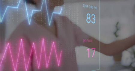 Image of colourful cardiographs over diverse female nurse and patient in hospital bed. Medicine, health and digital interface concept, digitally generated image.の写真素材